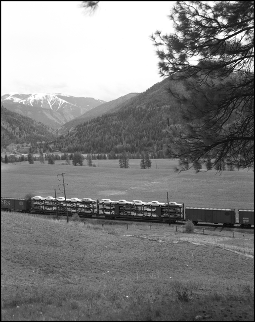 They would soon be a fixture of railroading and one of the few major traffic types to be won back to the railroads, but carload shipments of new automobiles were still uncommon when these cars passed on train 263 westbound through Montana