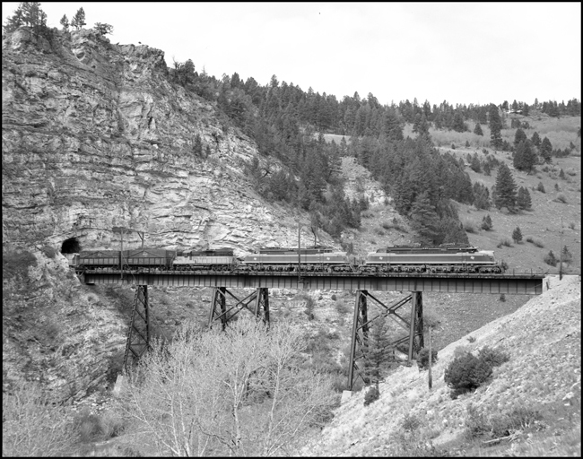 MILW E21, leads an east bound extra across the trestle near Eagle Nest, MT
