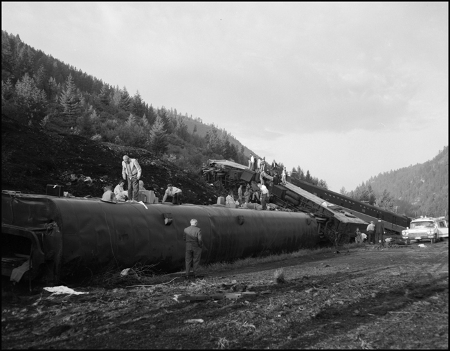 Wreckage of NP coach 353 and others.  Train No. 26, the North Coast Limited, derailed 1 mile west of Evaro, MT taking one life.