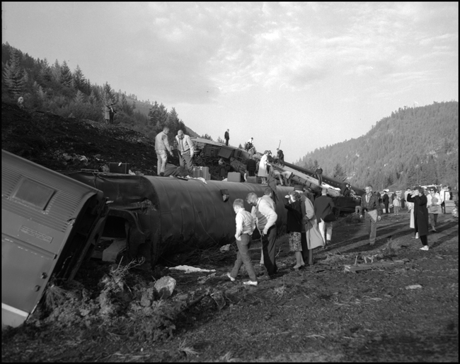Wreckage of NP coach 353 and others.  Train No. 26, the North Coast Limited, derailed 1 mile west of Evaro, MT taking one life.