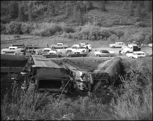 Wreckage of NP locomotives 6701C and 6511A.  Train No. 26, the North Coast Limited, derailed 1 mile west of Evaro, MT taking one life.