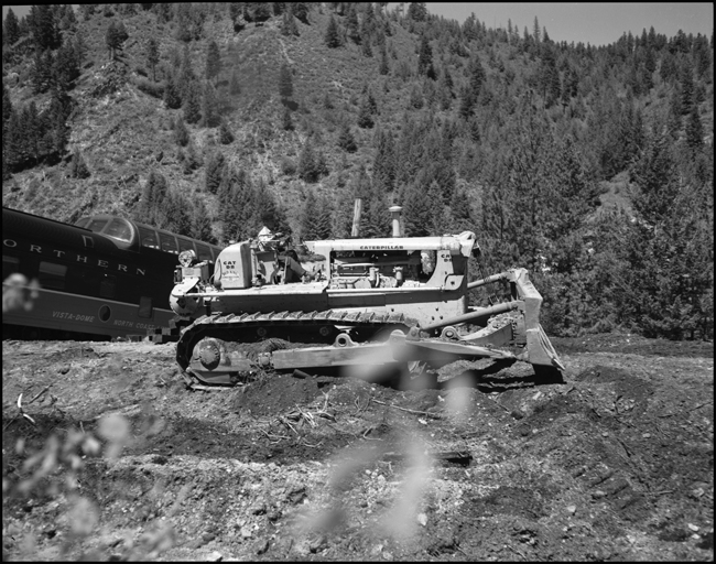 Wreckage of NP train No. 26 clean up. The North Coast Limited, derailed June 10, 1962 1 mile west of Evaro, MT taking one life.