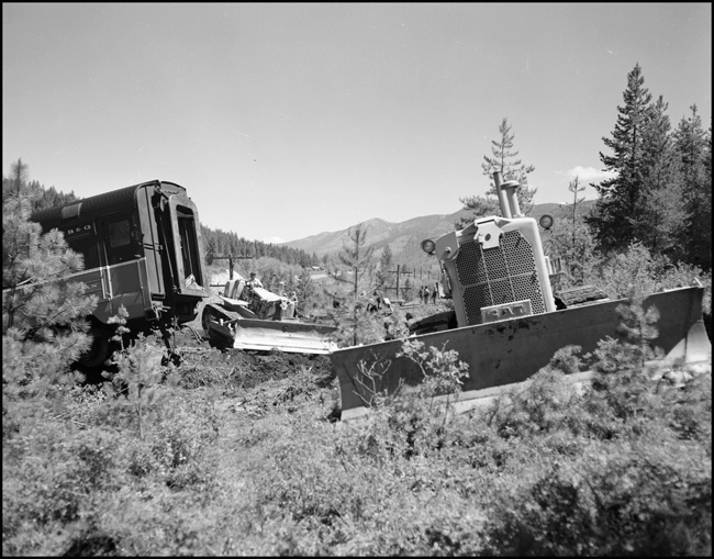 Wreckage of NP train No. 26 clean up. The North Coast Limited, derailed June 10, 1962 1 mile west of Evaro, MT taking one life.