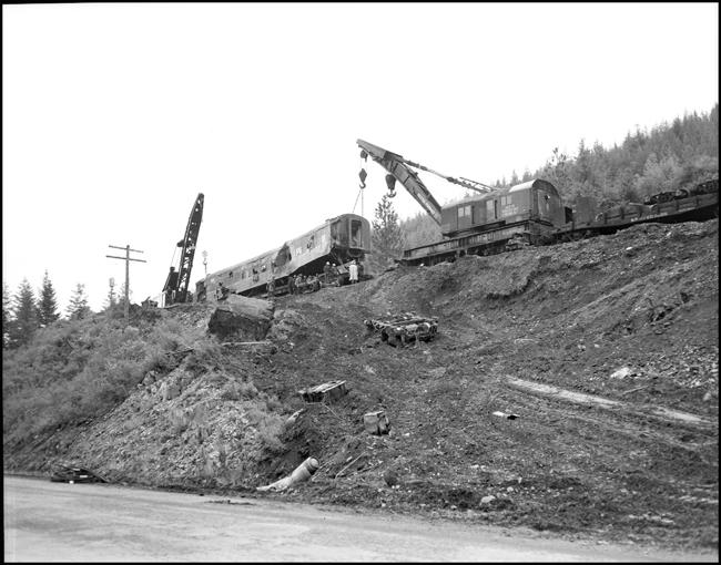 A coach being rerailed. The North Coast Limited, derailed June 10, 1962 1 mile west of Evaro, MT taking one life.