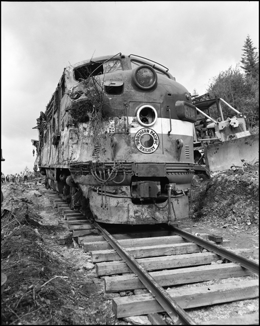Wreckage of 6510A is rerailed onto temporary track. Train No. 26, The North Coast Limited, derailed June 10, 1962 1 mile west of Evaro, MT taking one life.