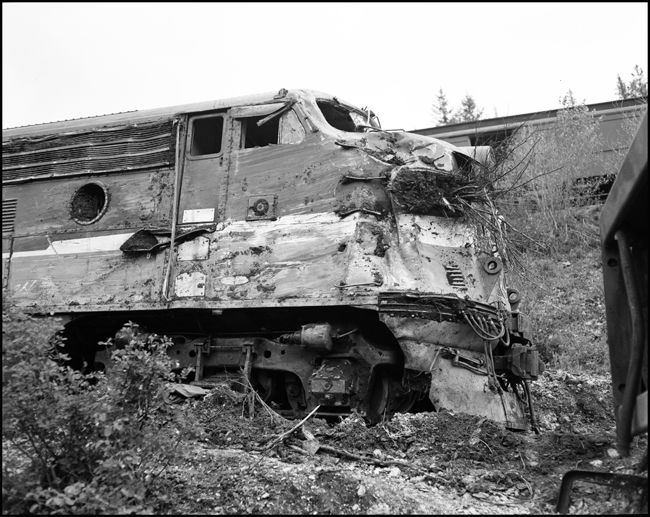 Wreckage of 6510A is rerailed onto temporary track. Train No. 26, The North Coast Limited, derailed June 10, 1962 1 mile west of Evaro, MT taking one life.