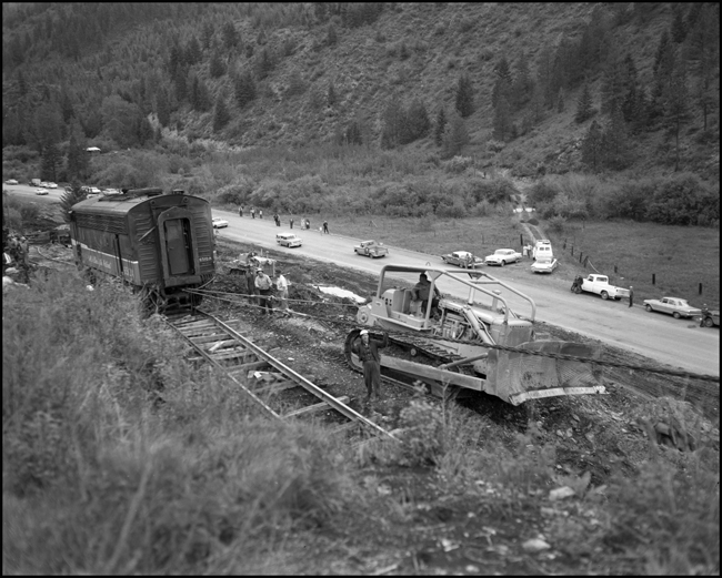 Wreckage of 6510A is rerailed onto temporary track. Train No. 26, The North Coast Limited, derailed June 10, 1962 1 mile west of Evaro, MT taking one life.