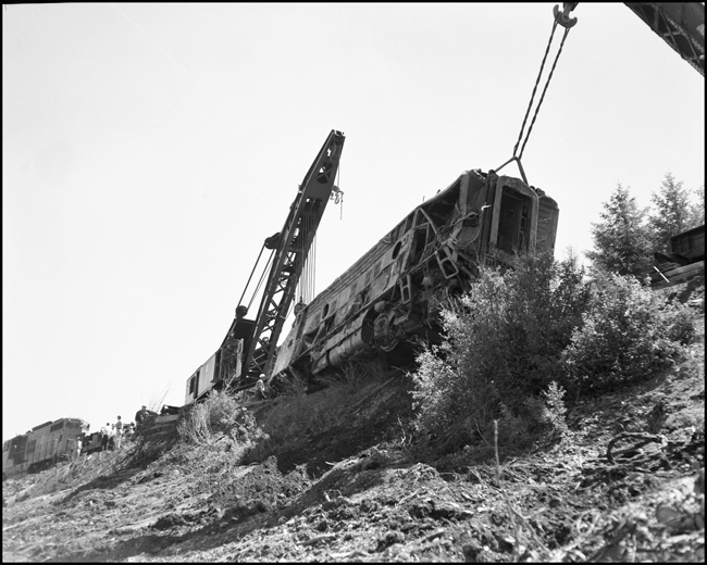 NP Wrecker #45 and another wrecker rerailing NP 6701C after the June 10th, 1962 accident.