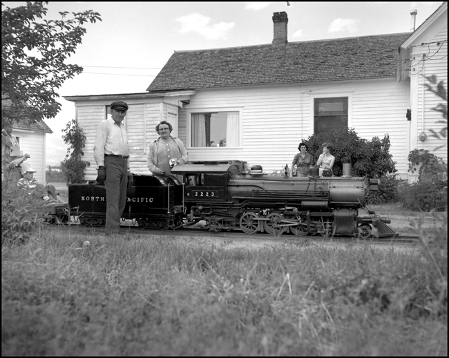 Children riding scale train pulled by replica of steam NP 2223 at Hamilton, MT.