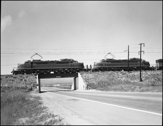 Two Milwaukee electric locomotives with MILW Train No. 264 crossing a bridge at Durant, MT