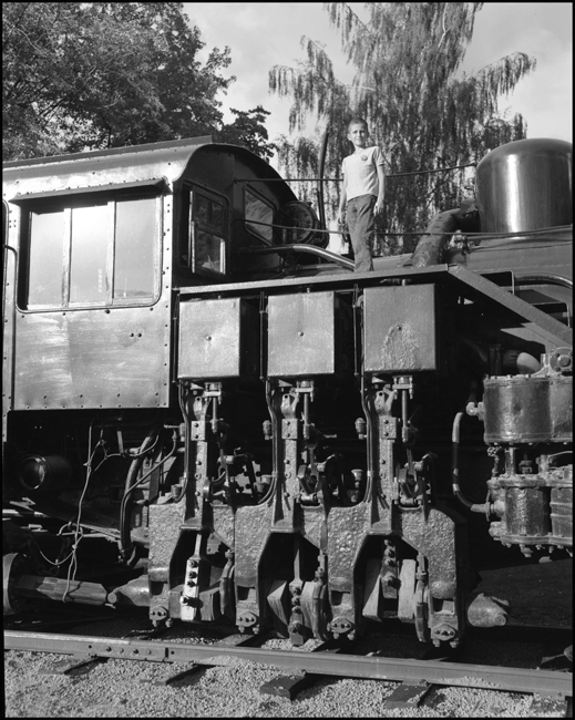 LDN, one of the Nixon Children or relatives standing on ACM 7 shay display at Bonner, MT.