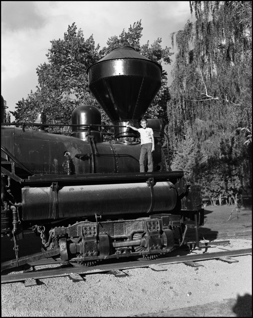 LDN, one of the Nixon Children or relatives standing on ACM 7 shay display at Bonner, MT.