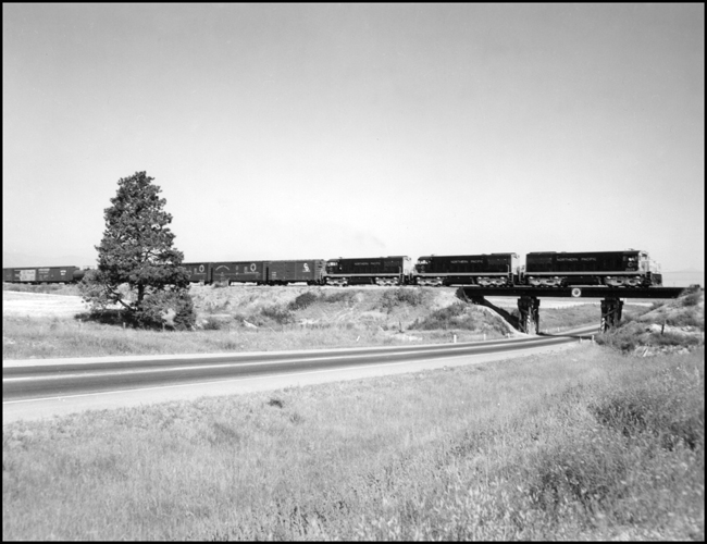 NP XE with GE U25C locomotives in the 2500 number series, near DeSmet, west of Missoula.