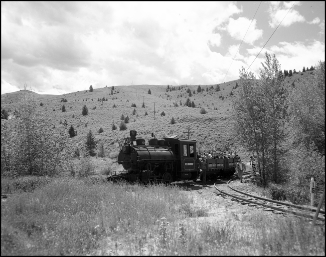 Alder Gulch Short Line (AGSL)  123 and loaded flat cars arriving Virginia City, MT.  