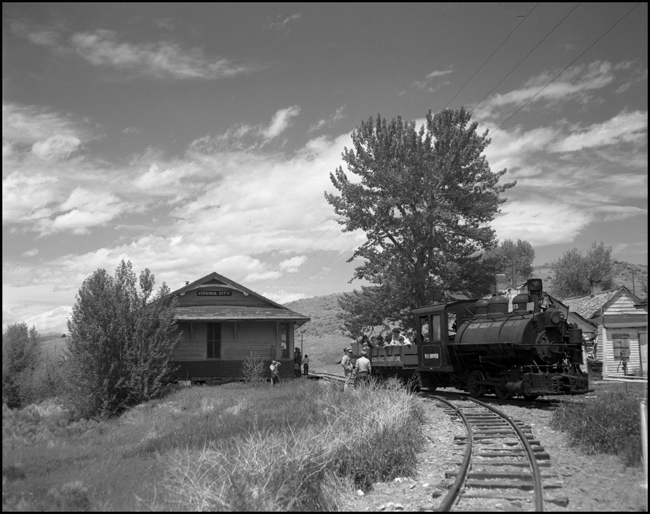 Alder Gulch Short Line (AGSL)  123 and loaded flat cars arriving Virginia City, MT.  