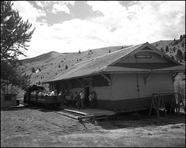 Alder Gulch Short Line (AGSL)  123 and loaded flat cars arrive at Virginia City, MT.  