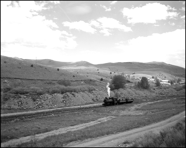 Alder Gulch Short Line (AGSL)  123 and loaded flat cars near Central City, MT.  