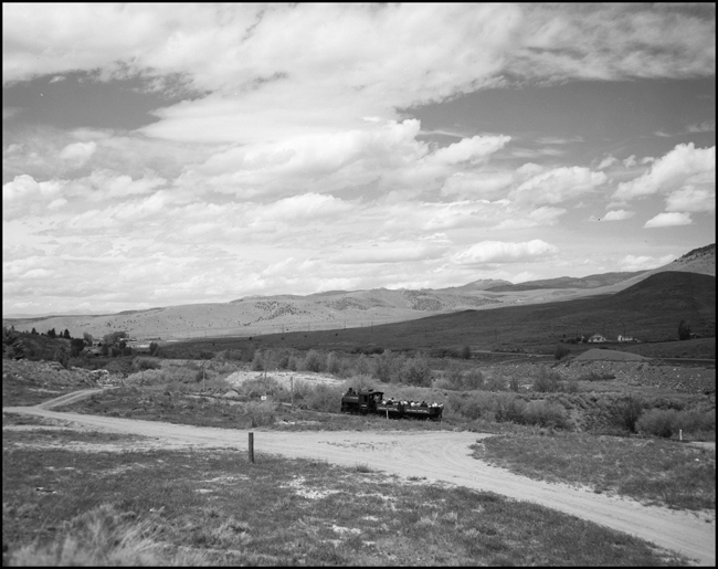Alder Gulch Short Line (AGSL)  123 and loaded flat cars near Central City, MT.  