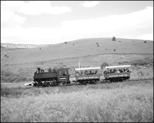 AGSL 123 with two car loads of passengers near Central City, MT.