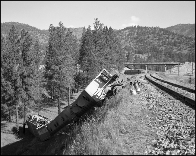 NP wreck between Plateau and Cyr, MT. , caused by boom of crane swinging into train.
