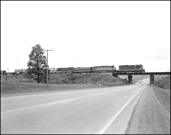 BN extra west west of Desmet, MT.  First, third, and fourth unit in consist are in NP paint and second unit is in SPS paint.