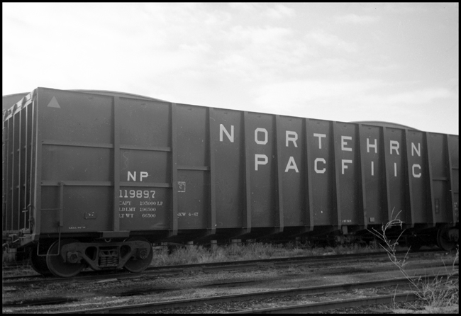 NP chip car 119897, built in 1967, as seen at Polson, MT.  ACI label is visible.