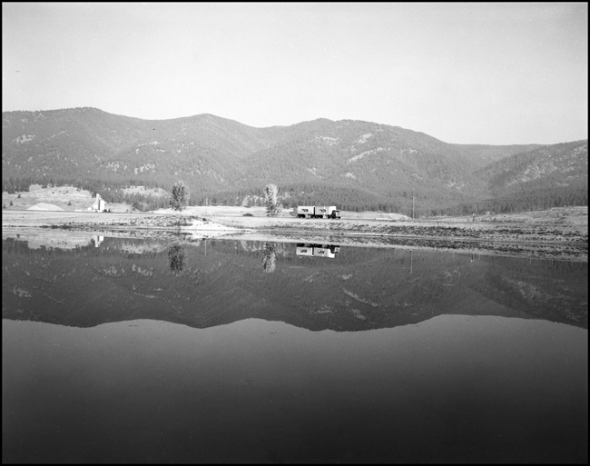 Highway traffic around Frenchtown, with wonderful reflection of mountains in Lake