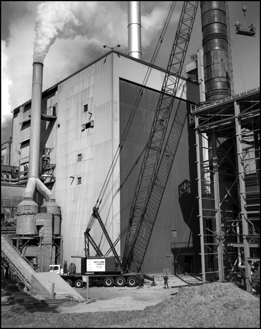 Jerry Culbert at Schilling Waldorf plant with large Loraine highway crane from Grey's Crane and Rigging Co. at Portland on hand, to make a big lift.  Crane weighs 200 Tons and has a 240 foot boom and rides on 18 tires on 6 axles.
