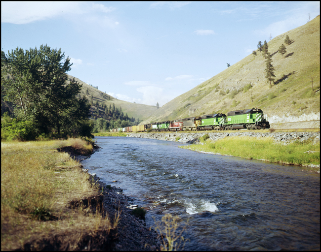 BN XCS900E with 7 units pulling train up hill east of Ravalli, MT.