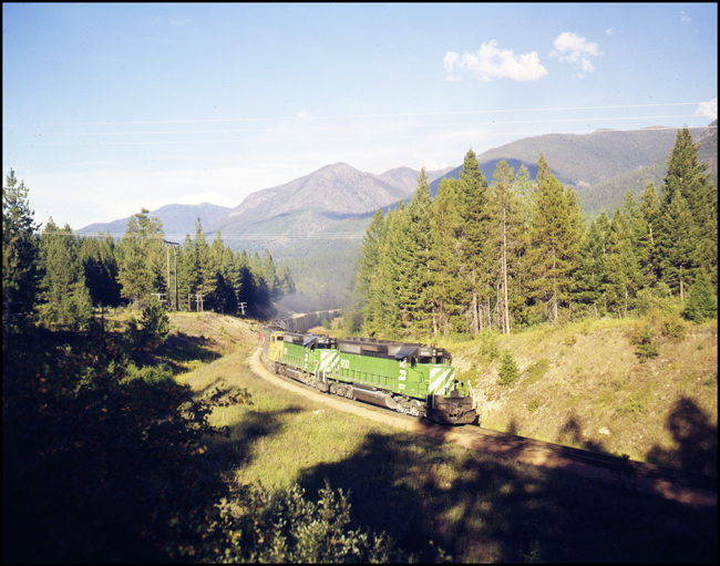 BN XCS900E with 7 units pulling train east of Schley, MT.