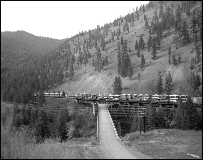 Autoracks in middle of MILW No. 261, near Cyr, MT. 