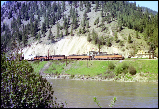 Two MILW electrics E-78 and E-72 in view, followed by a MILW Diesel road units 4008 and 10 moving XE near Superior, MT. 