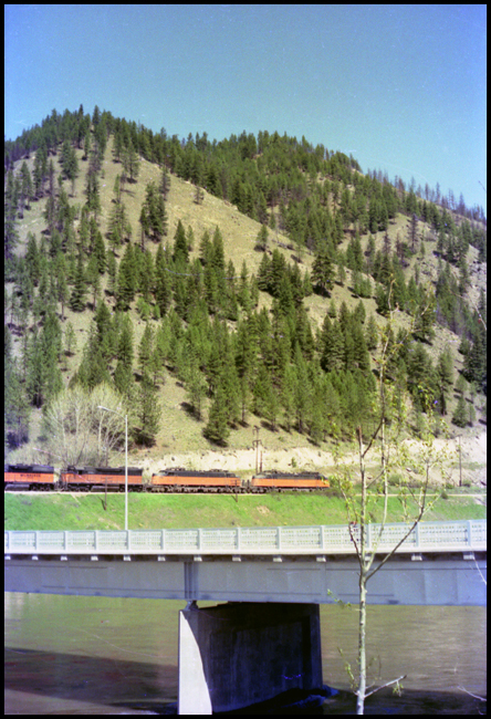 Two MILW electrics E-78 and E-72 in view, followed by a MILW Diesel road units 4008 and 10 moving XE near Superior, MT. 
