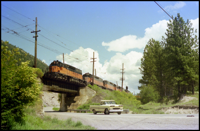 MILW XW  25, 175, 3020, 3011, and 30 crossing highway bridge west of Alberton, MT