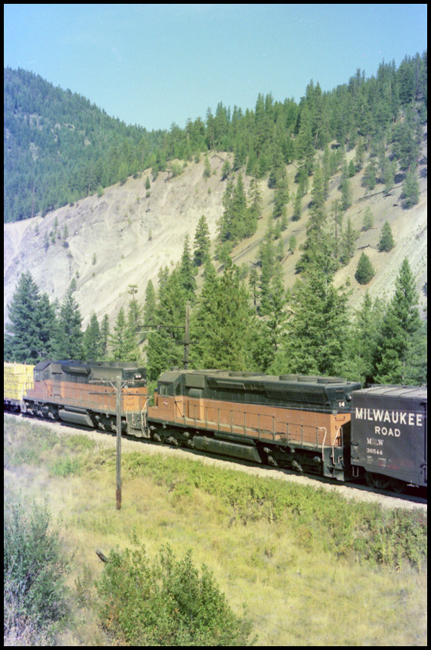 MILW Freight train with slave RCE locomotives MILW 14 and MILW 168 in middle of train near Cyr, MT