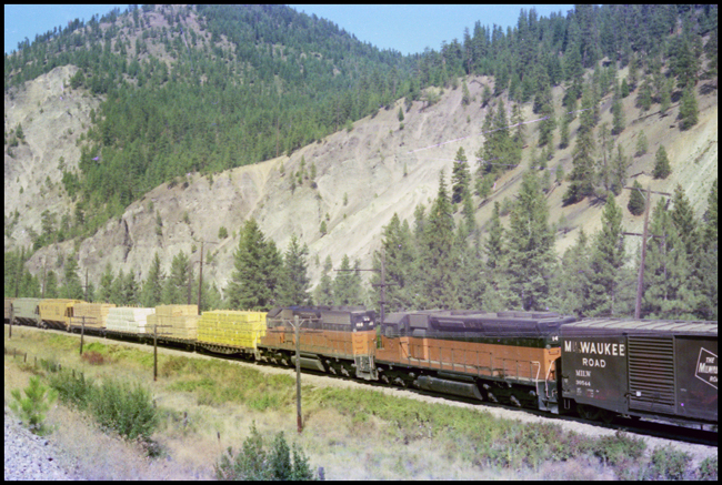 MILW Freight train with slave RCE locomotives MILW 14 and MILW 168 in middle of train near Cyr, MT