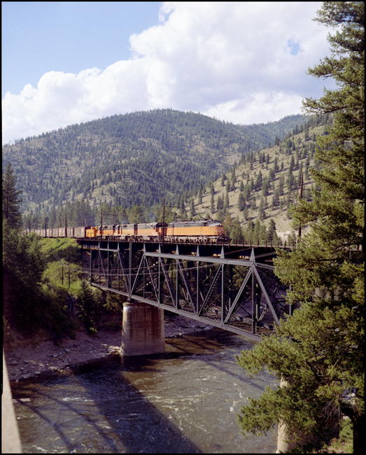 MILW  XE freight train crossing bridge at Cyr, MT.  This photo was a color 4 x 5 production.