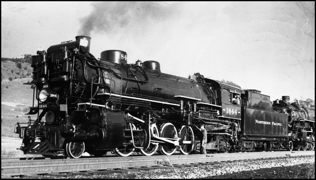 NP 1844, 2-8-2 Mikado Class W-5 double heads at Muir, Montana.