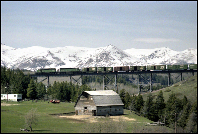 BN XCS  980 W crossing trestle east of Glacier Park, MT