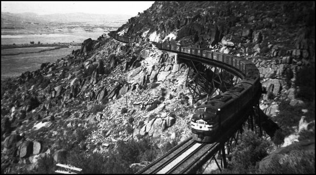 NP 6002, an EMD freight FT, heads an east bound freight train near Skones, MT. The Engineer is McGee.