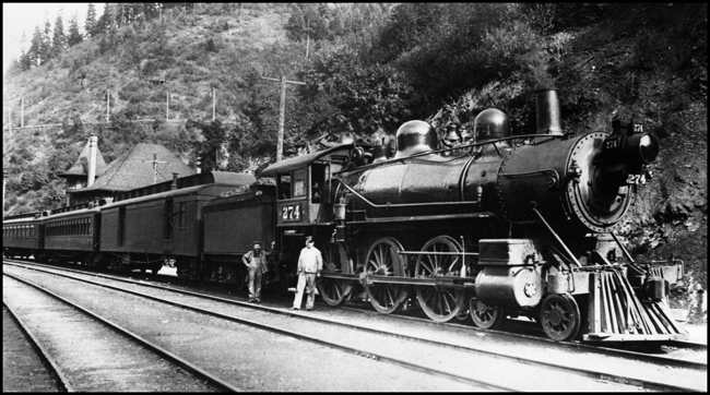 NP 274, a 4-6-0 10-Wheeler Class P with a passenger train at Wallace, Idaho.