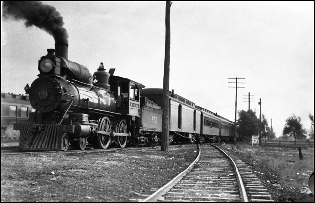 NP 651, a 4-4-0 American Std Class B , Former NP 404, with a passenger train at Livingston, Montana.