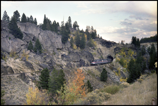 BN Train No. 17, with AMT 244-247 coming out of tunnel near Welch, MT on Butte Mountain.