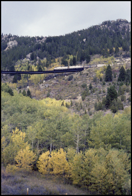 BN Train No. 17, with AMT 244-247  east of Skones, MT on Butte Mountain crossing trestle.