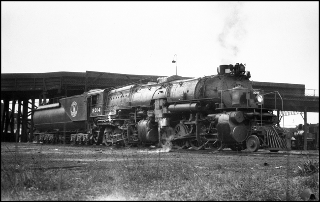 Barely fitting under the Belknap Street viaduct, a R-1 2-8-8-0 leaves the Superior engine terminal.  These engines were standard power on ore trains to the Mesabi iron mines, and occasionally hauled heavy freight to Grand Forks too.