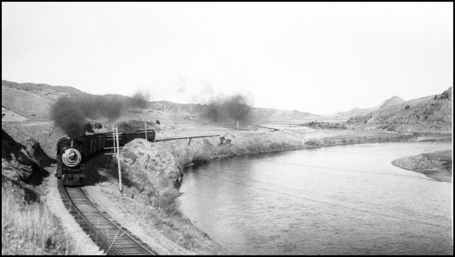 A Q-1 Pacific ahndles a short mixed train on a Montana branch as the depression nears its lowest ebb.  There is not much traffic moving today, or on any recent day.  The 1906 ALCO will survive the depression, unlike many Q-1's and last another 20 years.