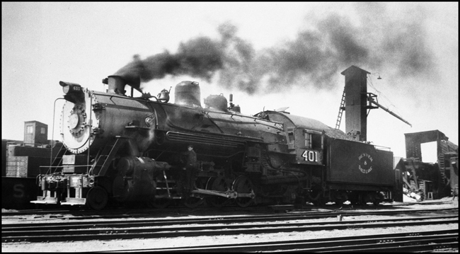 An Lima Mikado, a small engin e by Rocky Mountain standards, is waiting for a trip west.  The engine of owned by the Moffat Road, a shortline that will later become a part of the Denver & Rio Grande Western.