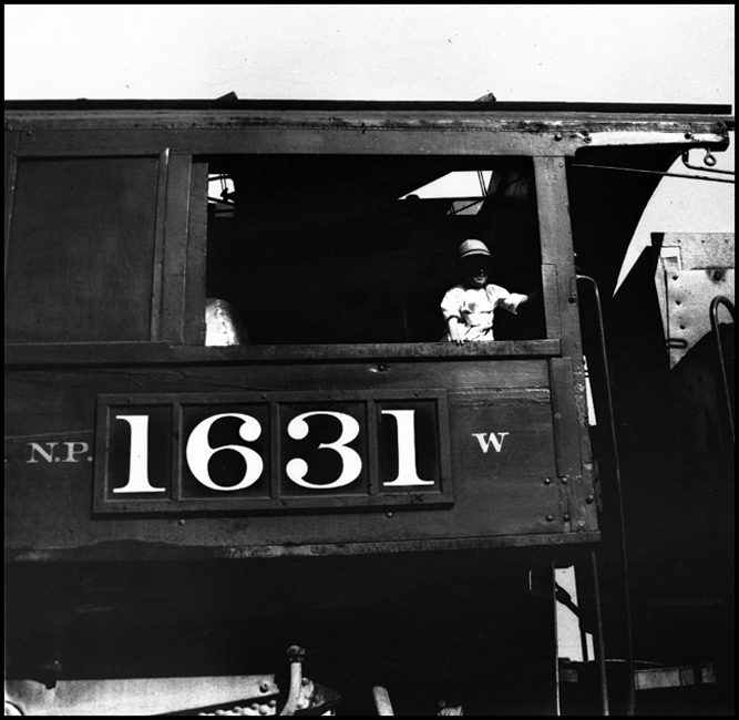 Donald Nixon, the photographer's younger brother, visits the cab of NP 1631, a class W Mikado. 