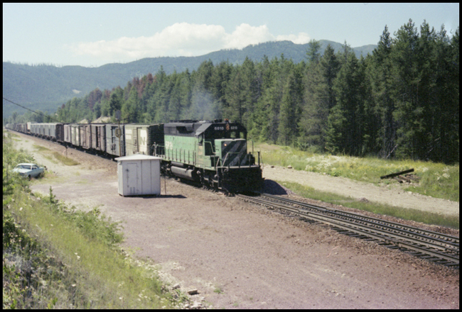 BN X6818E with freight west of Belton, MT