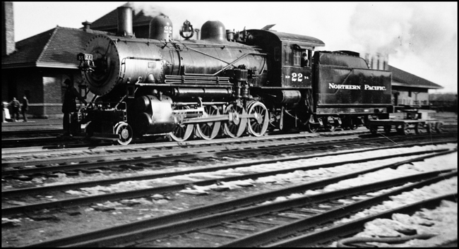 Its train time at Jamestown, and people are out on the platform.  This Y-1 switcher has probably come down to add or subtract a car from the expected passenger train